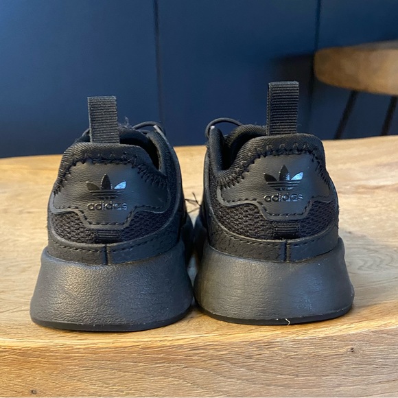 Black adidas toddler sneakers. - Picture 4 of 7